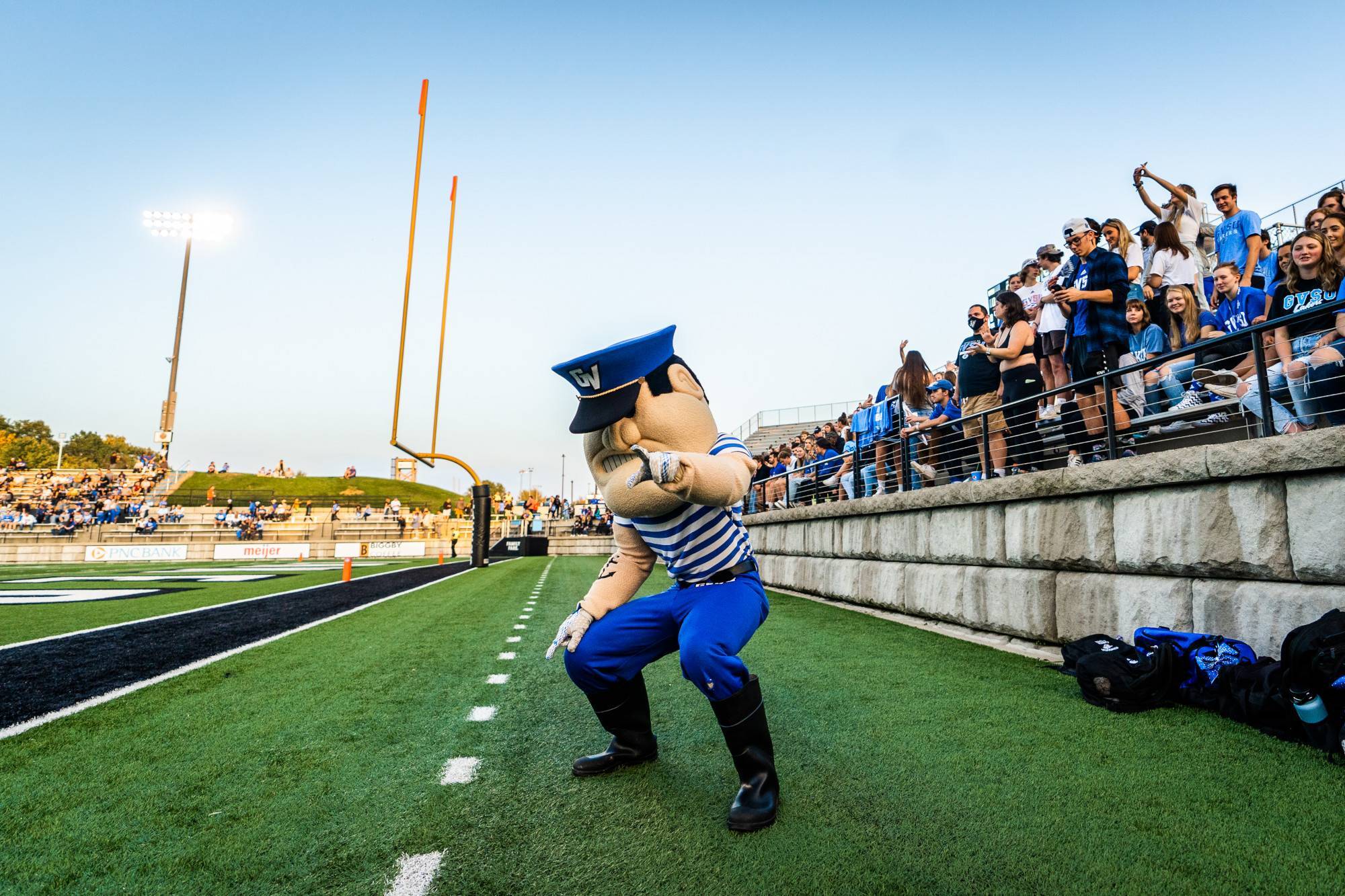 Louie points at the camera in the end zone during a Football Game